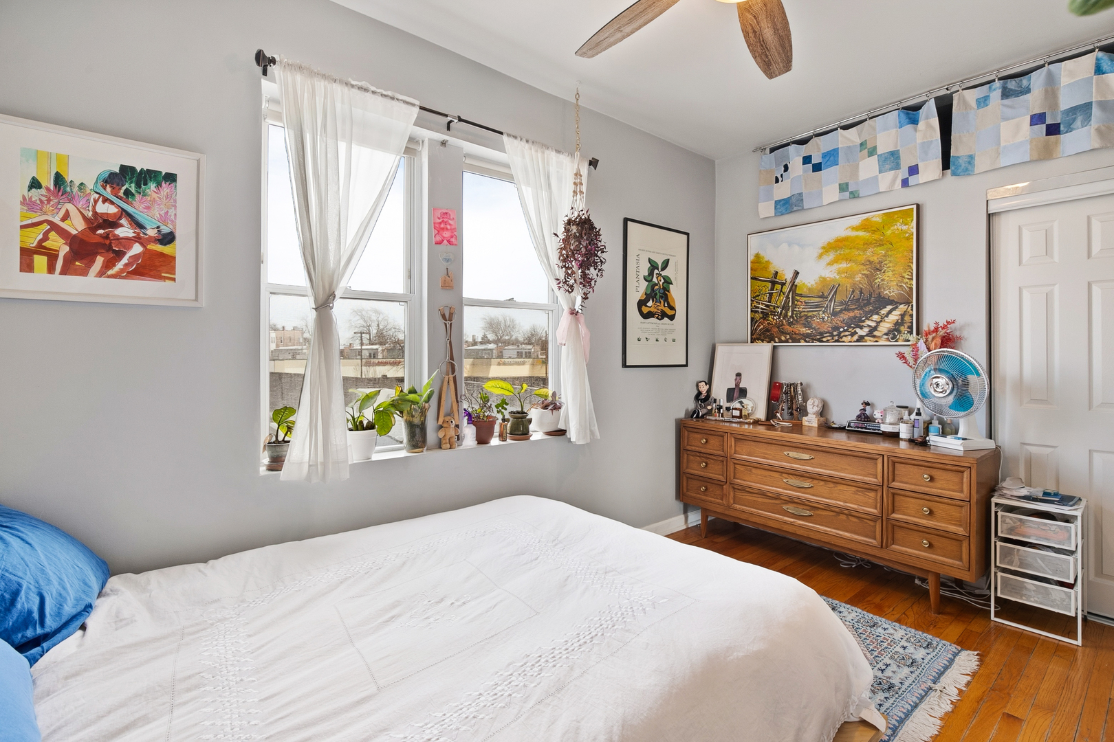 4006 West Nelson Street, Unit 6B Chicago, IL 60641 - Photo 10 of 13 a bedroom with a bed and a window