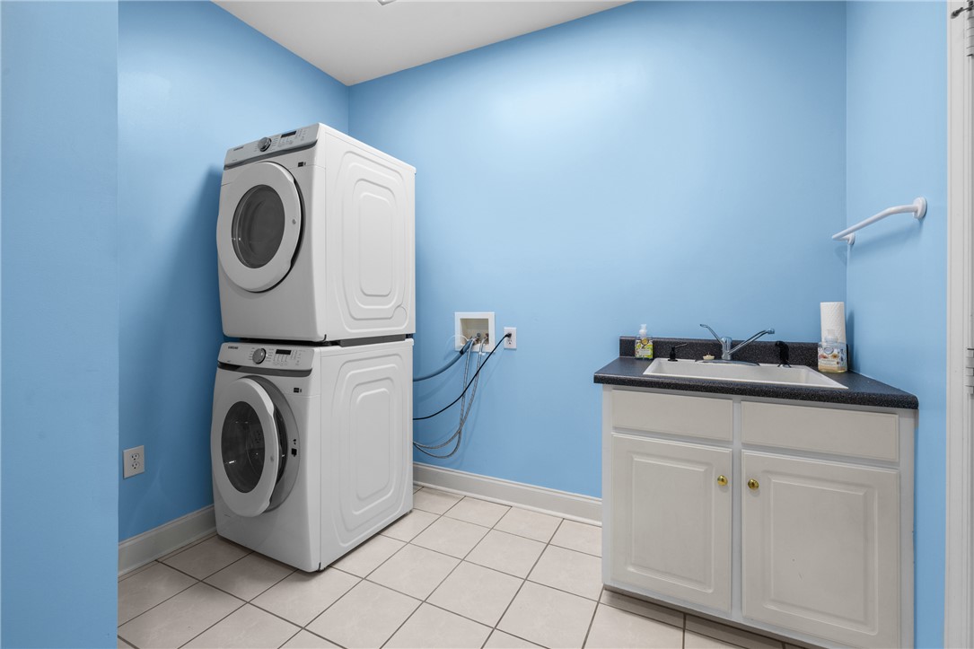 110 Brookstone Way Central, SC 29630 - Photo 27 of 46 This bright laundry area provides efficient utility with a convenient sink and stacked appliances.