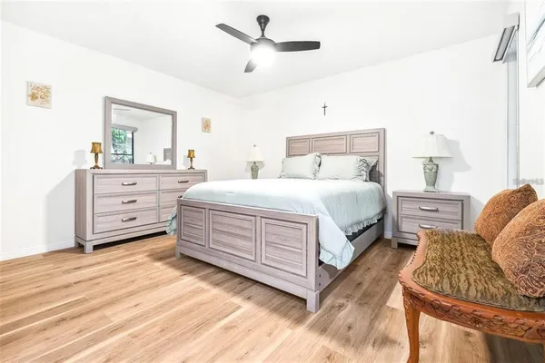 a bedroom with a bed and a dresser