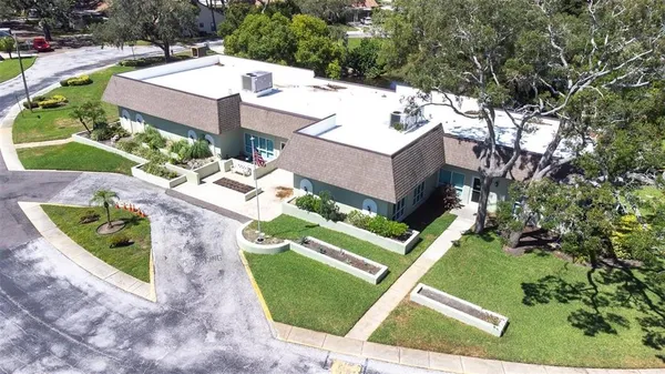 a view of a backyard with a patio and plants