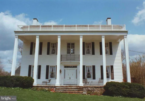 a view of a building with a yard