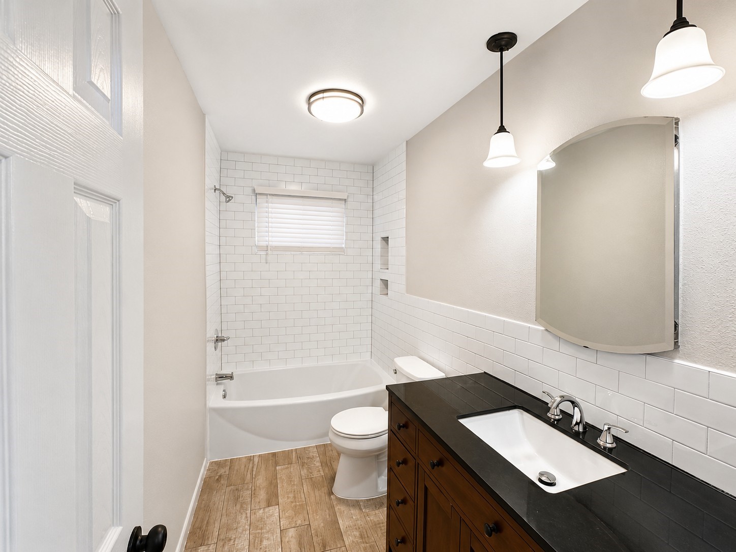 15950 Chimney Rock Road Missouri City, TX 77489 - Photo 4 of 9 a bathroom with a sink a toilet a mirror and shower