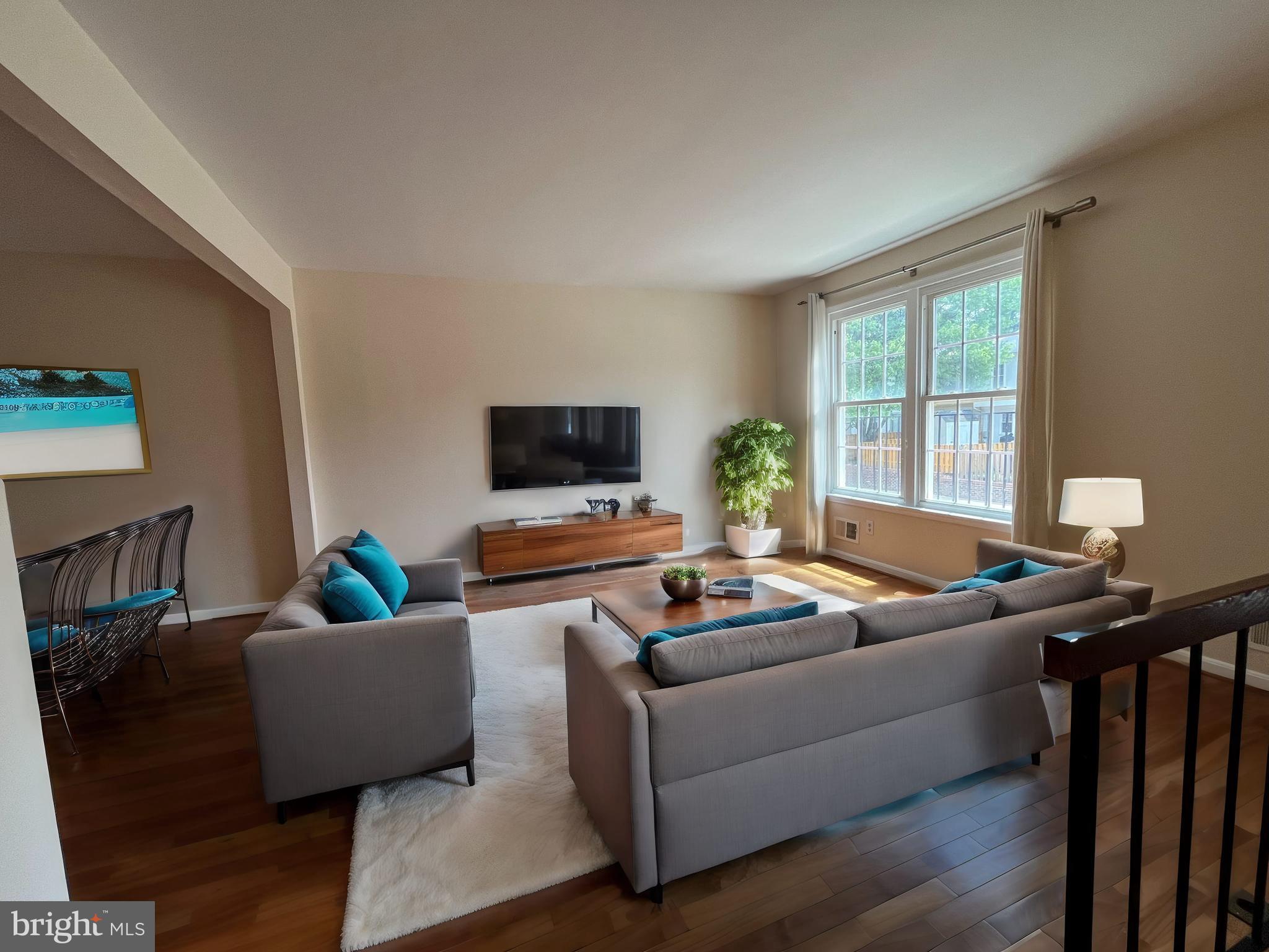 3 Prairie Rose Lane, Unit 32 Gaithersburg, MD 20878 - Photo 1 of 1 a living room with furniture and a flat screen tv