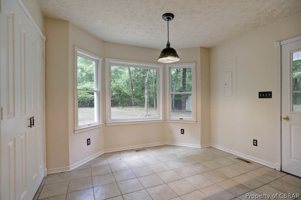 7025 Mumford Cove Road Hayes, VA 23072 - Photo 15 of 43 Eat in kitchen space with pantry.