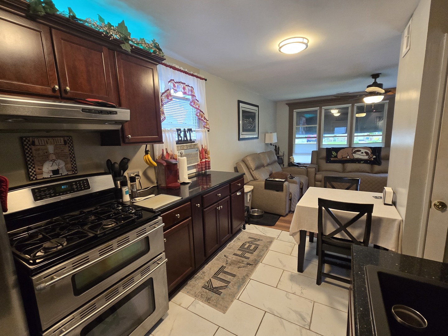 14932 Kedvale Avenue Midlothian, IL 60445 - Photo 3 of 17 a kitchen with a stove and a microwave