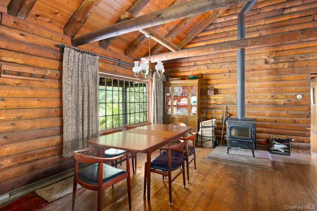 a dining room with furniture and wooden floor