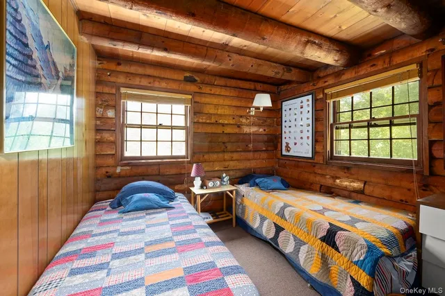 a bedroom with bed and a window