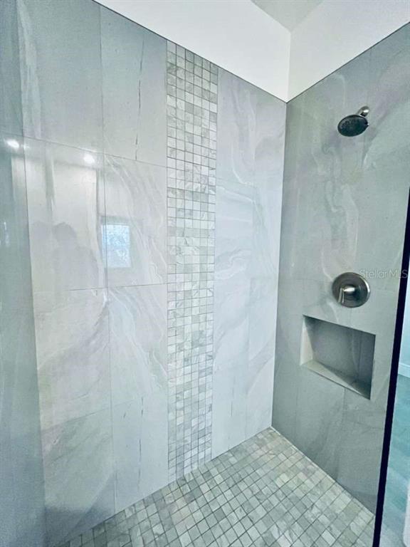 3311 Whitestone Circle, Unit 206 Kissimmee, FL 34741 - Photo 19 of 26 a bathroom with a shower