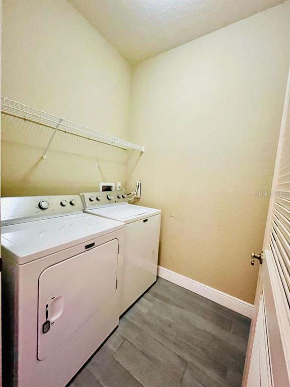3311 Whitestone Circle, Unit 206 Kissimmee, FL 34741 - Photo 24 of 26 a utility room with dryer and washer