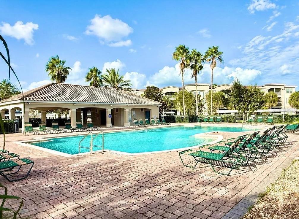 3311 Whitestone Circle, Unit 206 Kissimmee, FL 34741 - Photo 25 of 26 a front view of house with outdoor space and trees