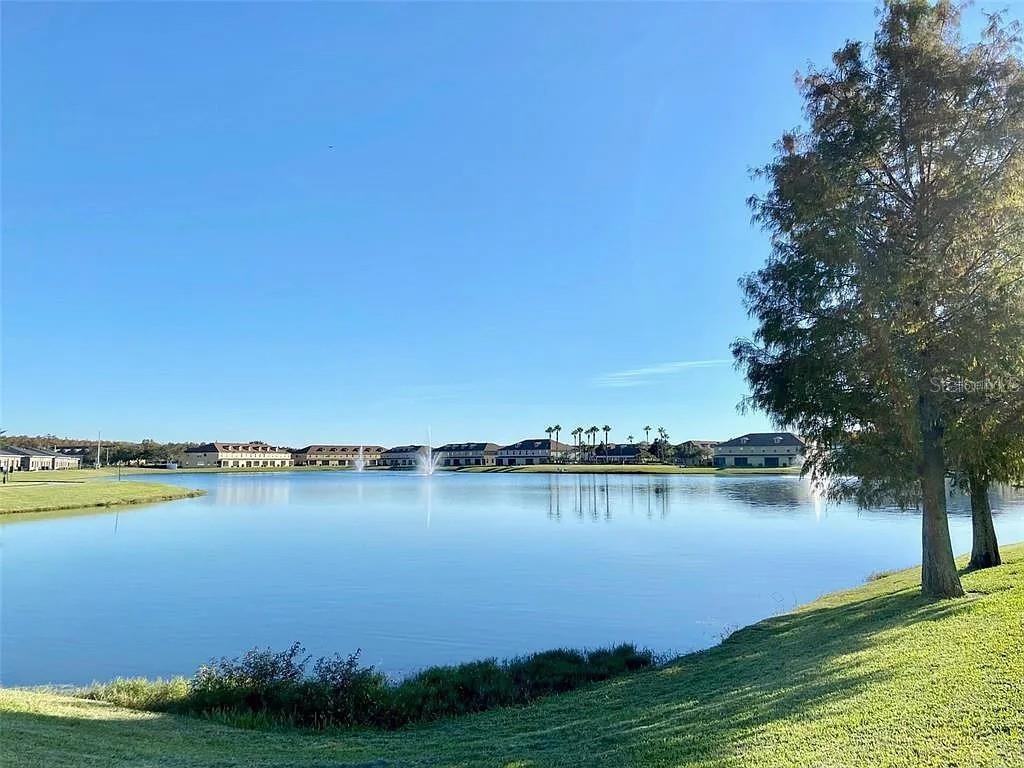 3311 Whitestone Circle, Unit 206 Kissimmee, FL 34741 - Photo 26 of 26 a view of a lake with houses in the back