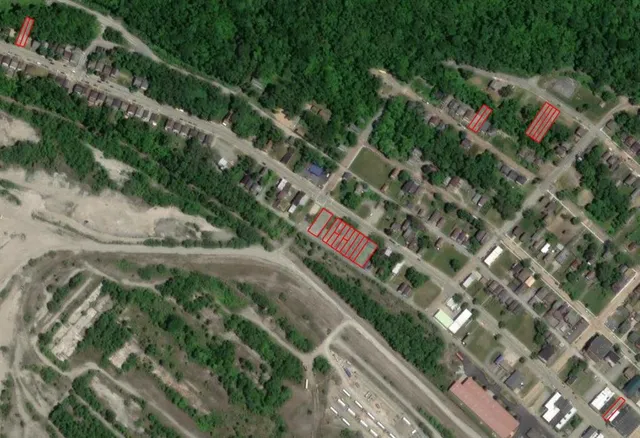 an aerial view of house with yard and outdoor seating