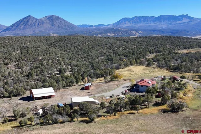 a view of a city with mountains in the background