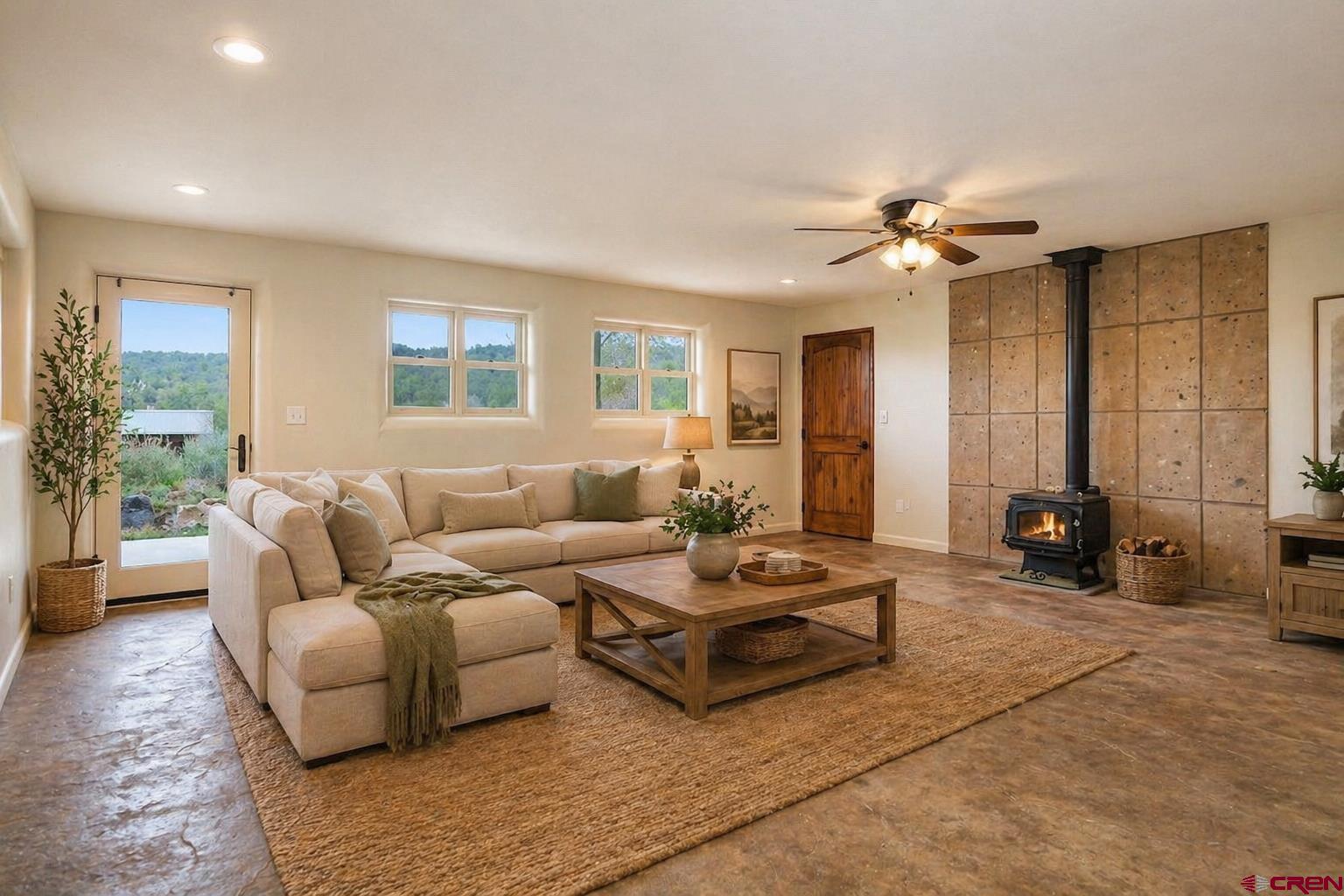 78300 Hunters Ridge Lane Crawford, CO 81415 - Photo 13 of 32 a living room with furniture ceiling fan and a window