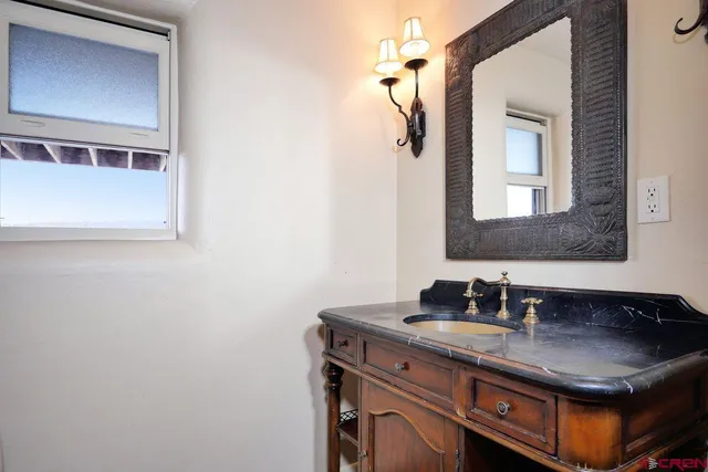 a white toilet sitting next to a shower