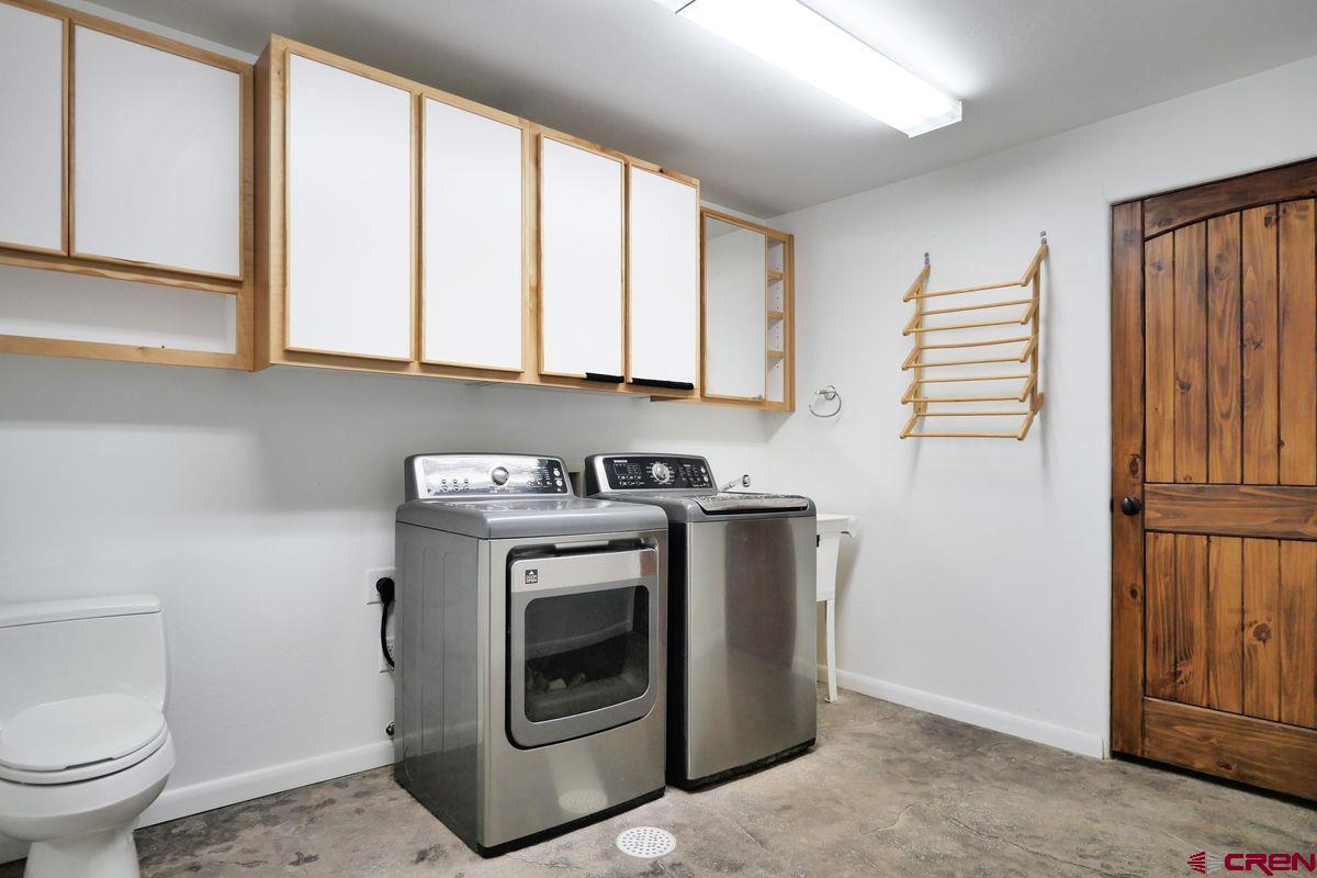 78300 Hunters Ridge Lane Crawford, CO 81415 - Photo 20 of 32 a utility room with dryer and washer