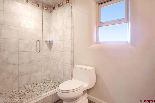 a view of an empty room with stairs