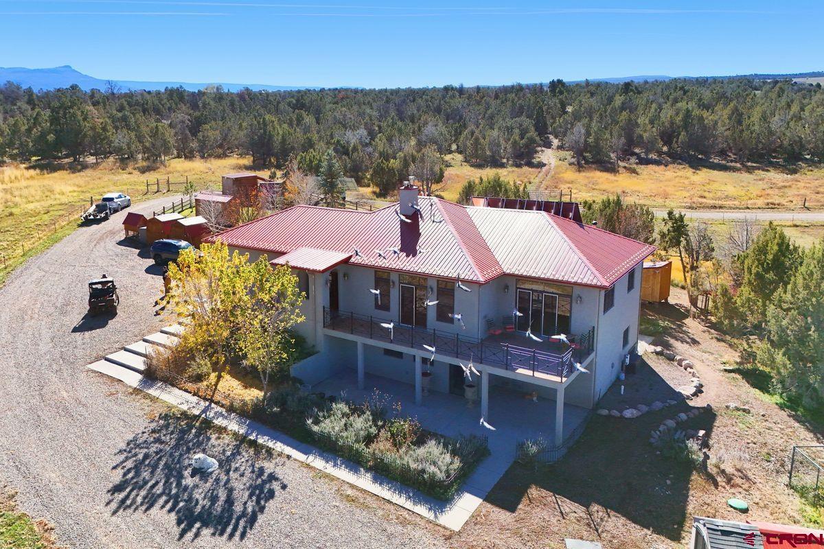 78300 Hunters Ridge Lane Crawford, CO 81415 - Photo 2 of 32 a view of a house with a yard from a balcony