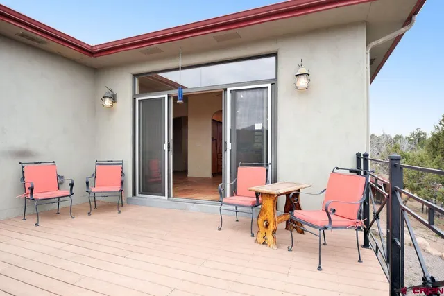 a view of a terrace with furniture and mountain view