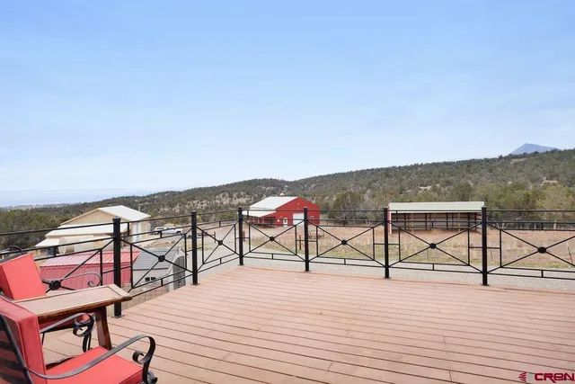 a view of a patio with a table and chairs