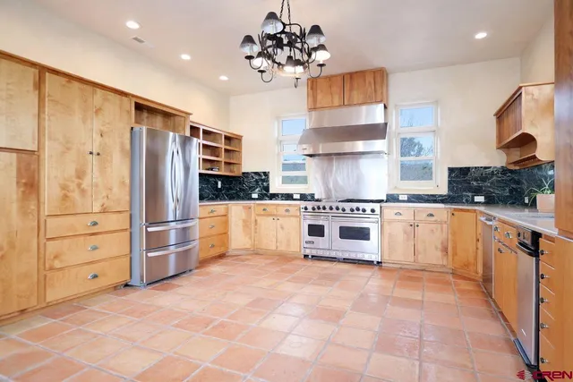 a view of a livingroom with a kitchen