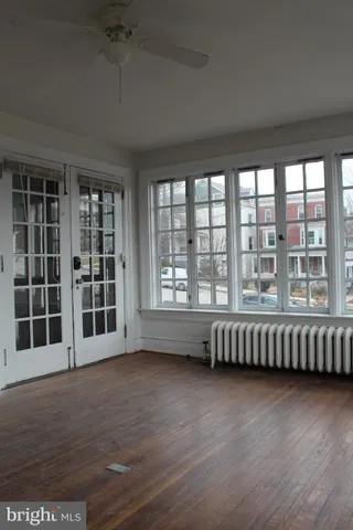 a view of empty room with a fireplace