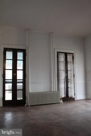 a bathroom with a toilet and a window