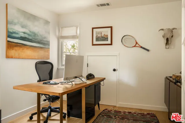 a view of a workspace with furniture
