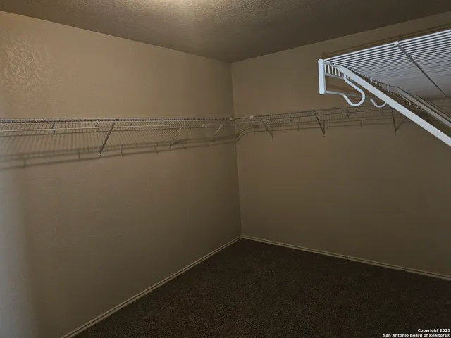 a view of a room with racks on the wall