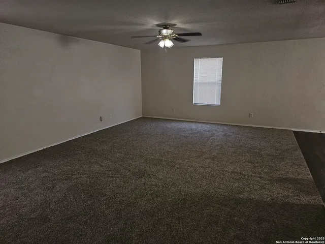 a view of a big room with carpet