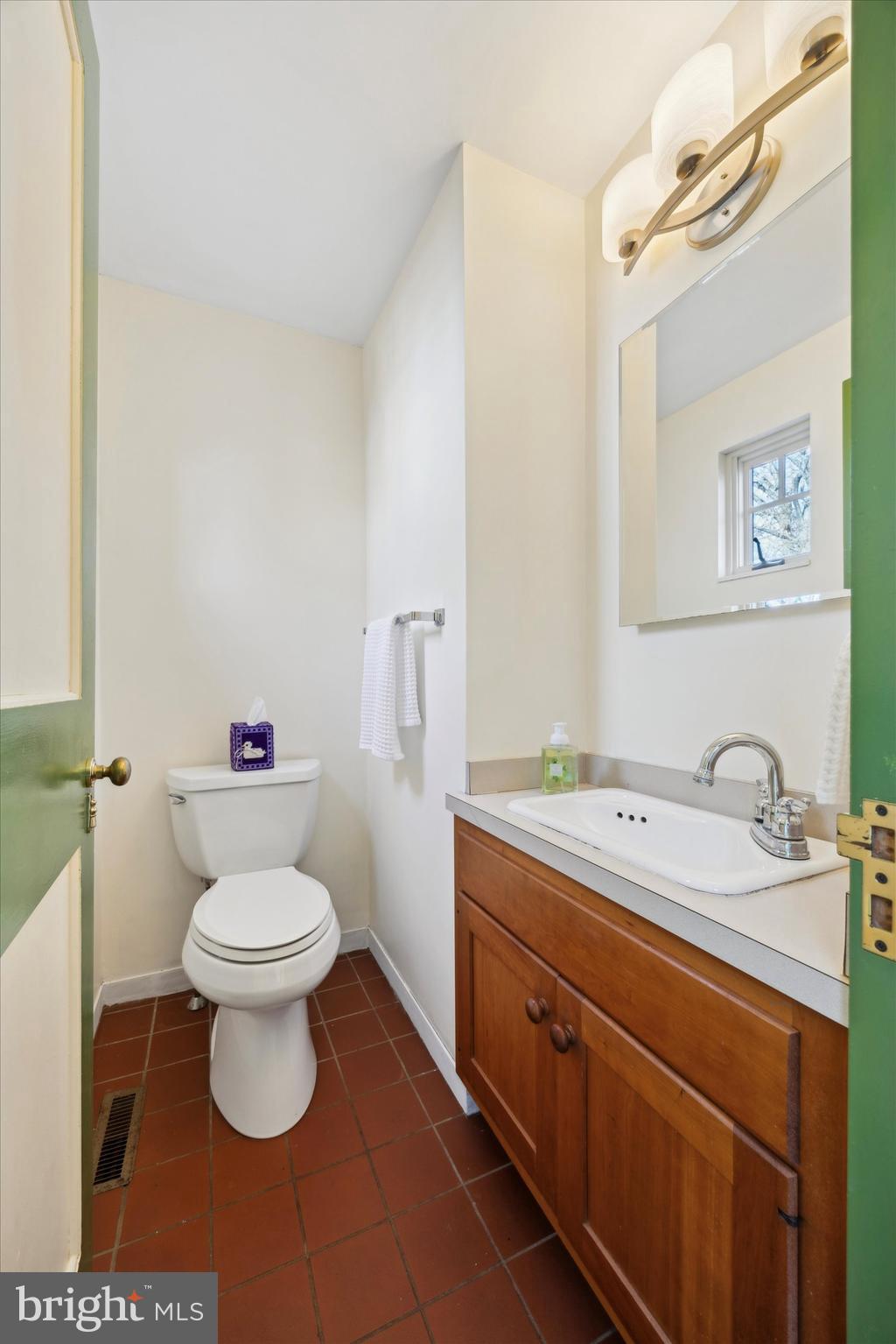 1991 Swedesford Road Malvern, PA 19355 - Photo 23 of 67 a bathroom with a sink a toilet and a mirror