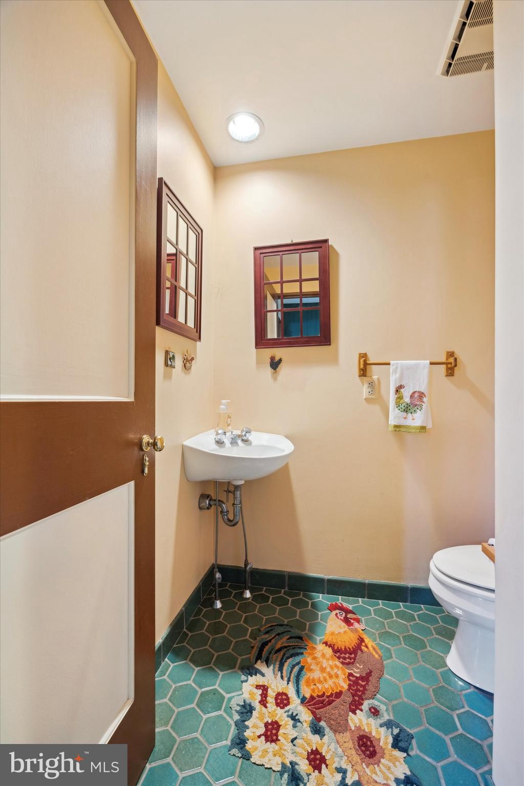 1991 Swedesford Road Malvern, PA 19355 - Photo 31 of 67 a bathroom with a sink toilet and a mirror