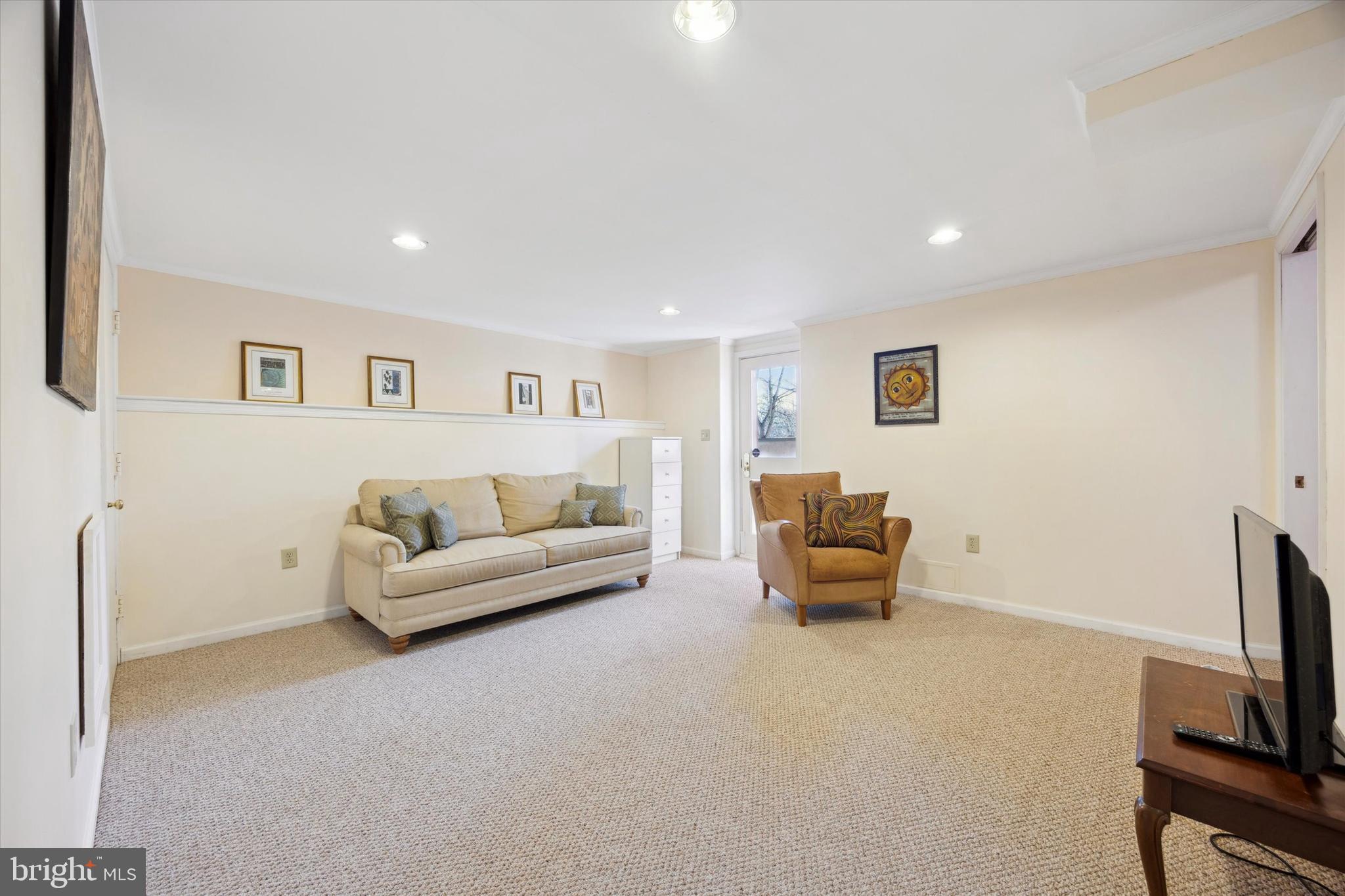 1991 Swedesford Road Malvern, PA 19355 - Photo 44 of 67 a living room with furniture and a flat screen tv