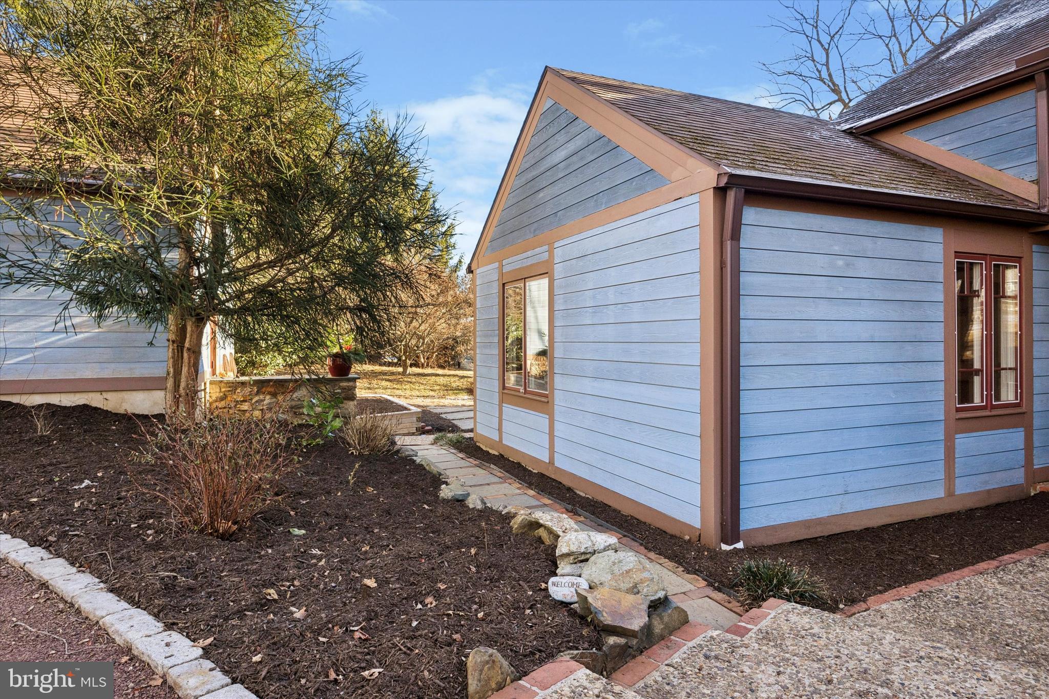 1991 Swedesford Road Malvern, PA 19355 - Photo 60 of 67 a view of a backyard with large trees and wooden fence