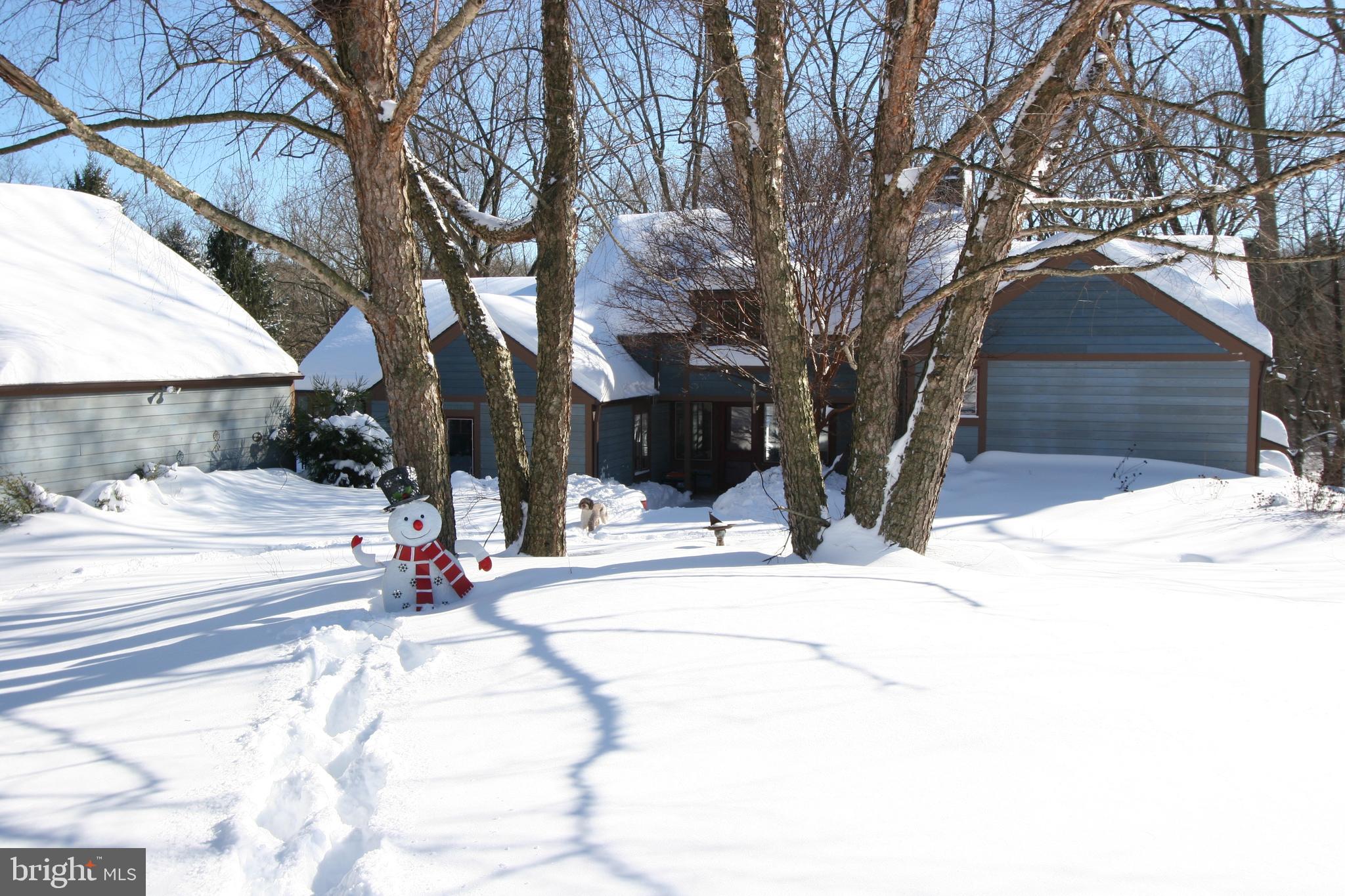 1991 Swedesford Road Malvern, PA 19355 - Photo 67 of 67 a view of a white house with a yard covered with snow