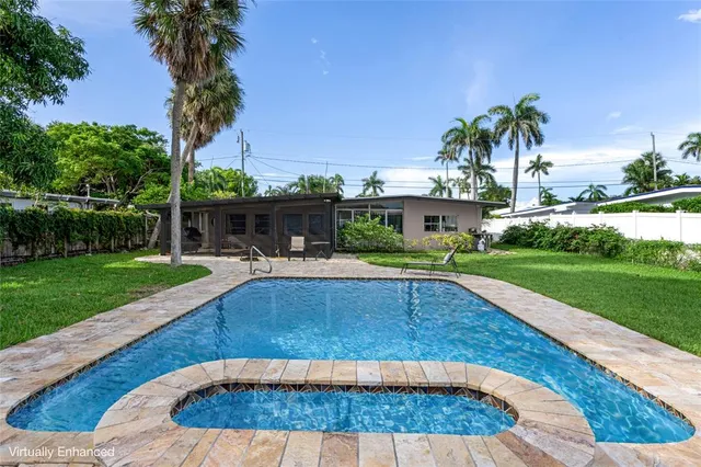 a view of swimming pool with a patio