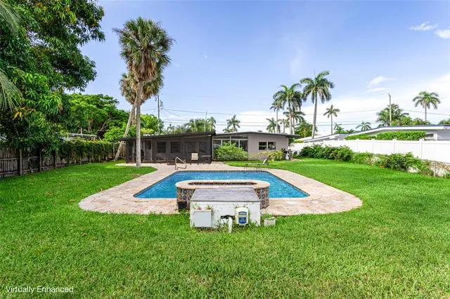 a swimming pool with outdoor seating and garden