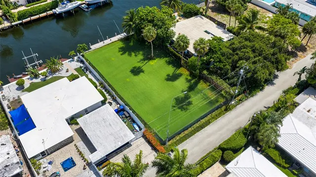 an aerial view of a residential houses with outdoor space