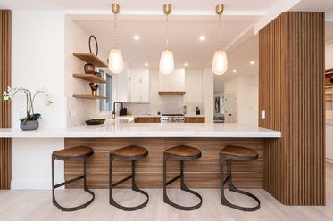 a kitchen with a table and chairs in it