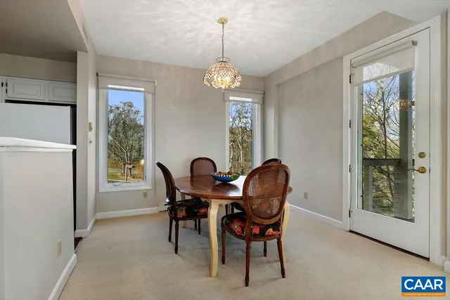 a white refrigerator freezer and a stove sitting inside of a kitchen