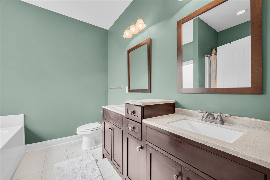 5 Drakeford Court Anderson, SC 29621 - Photo 33 of 46 A spacious bathroom features dual vanities and clean tile flooring.