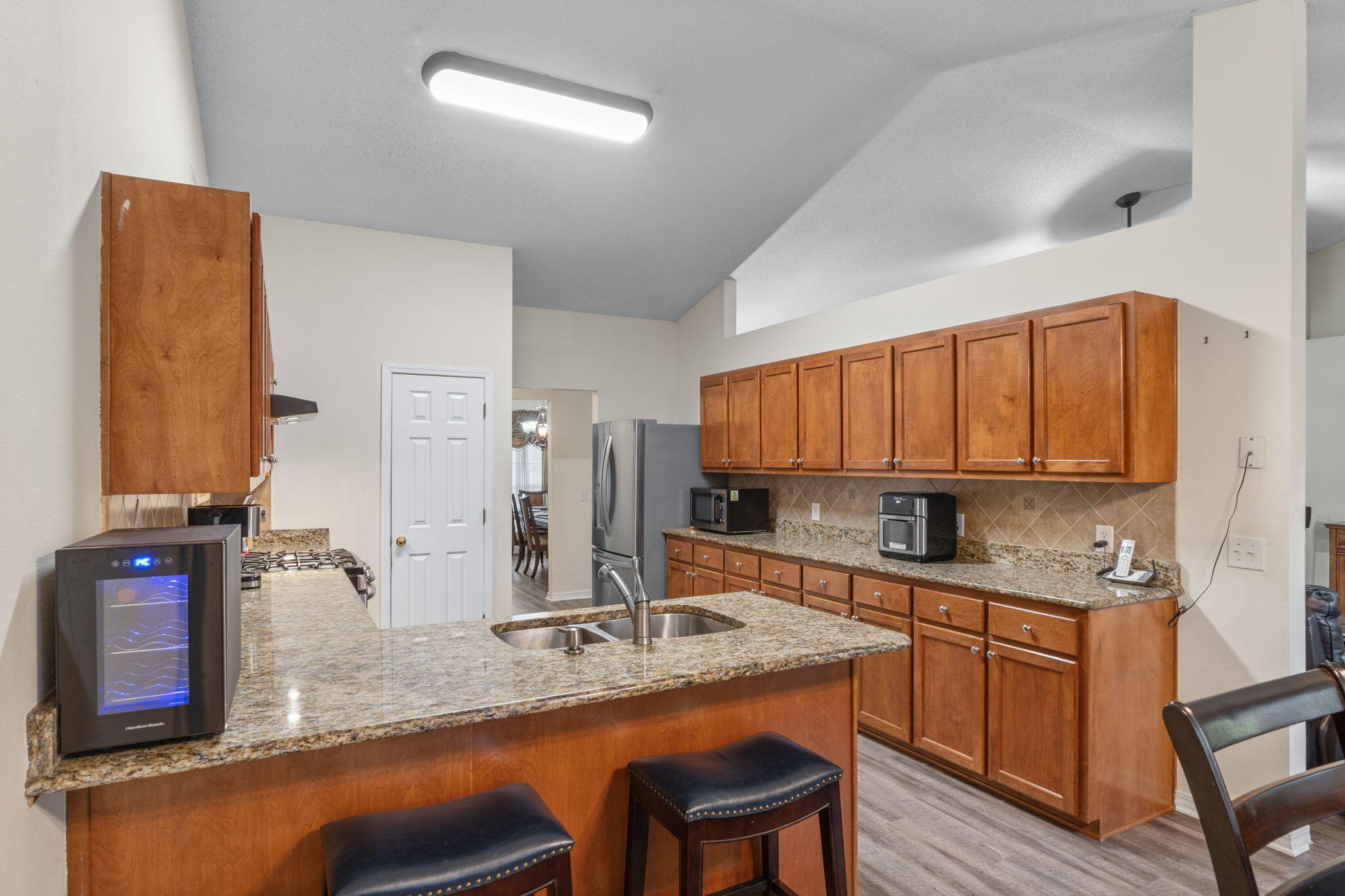 7036 Rampart Way Pensacola, FL 32505 - Photo 14 of 39 a kitchen with stainless steel appliances granite countertop a sink stove and cabinets