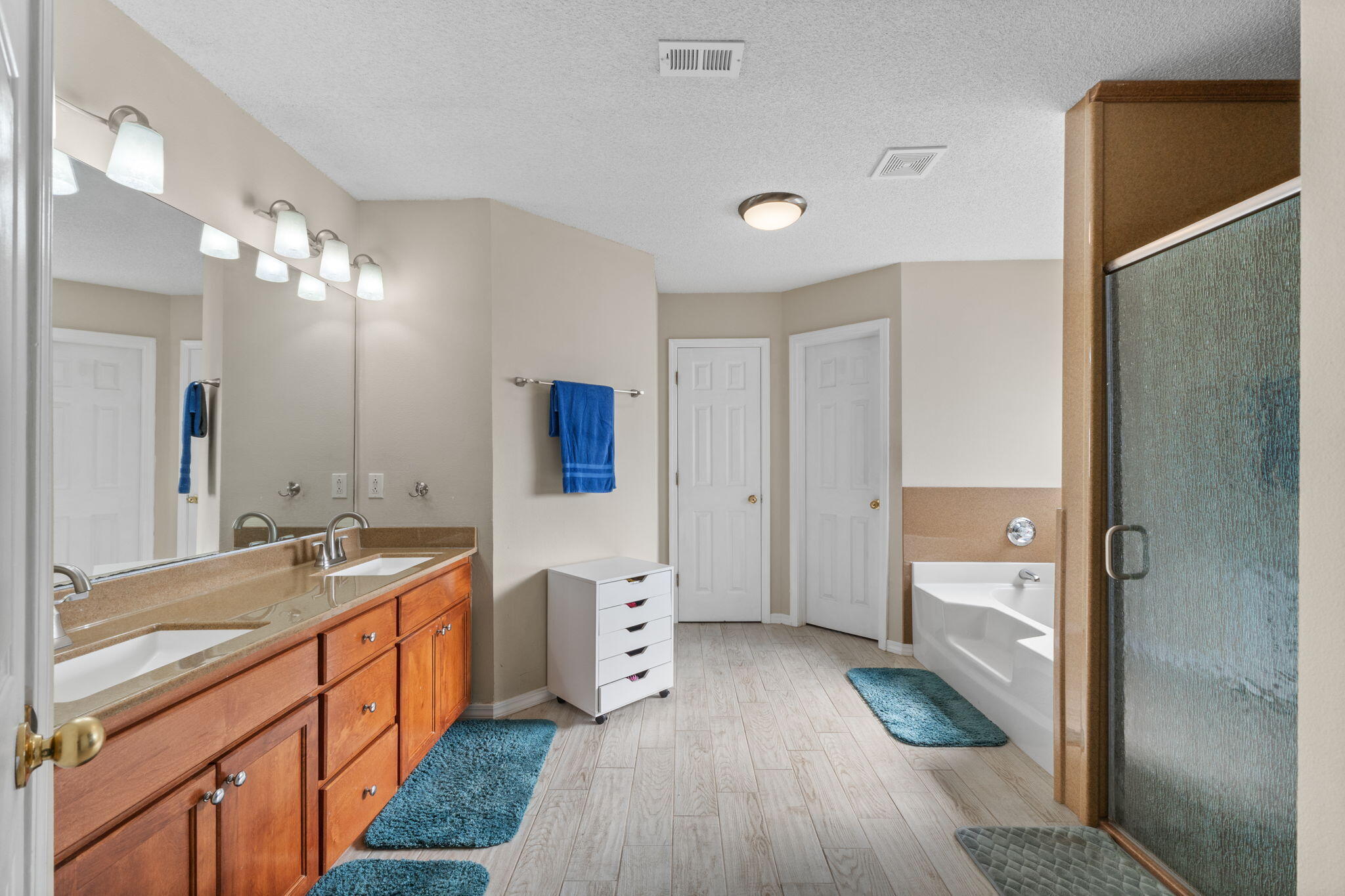 7036 Rampart Way Pensacola, FL 32505 - Photo 19 of 39 a bathroom with a sink a mirror and a shower