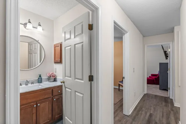 a bathroom with a sink vanity and a mirror