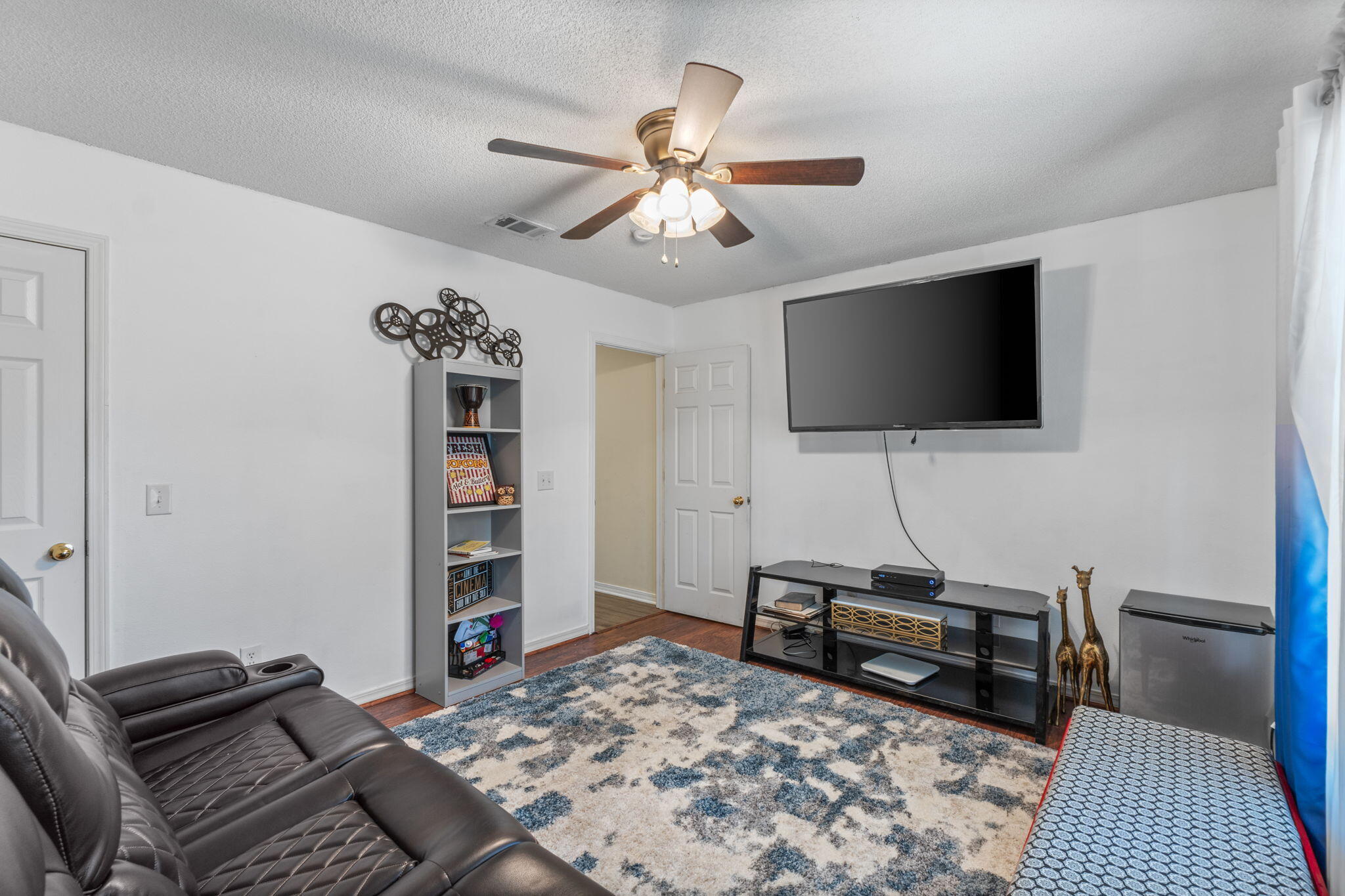 7036 Rampart Way Pensacola, FL 32505 - Photo 30 of 39 a bedroom with a bed and a flat screen tv