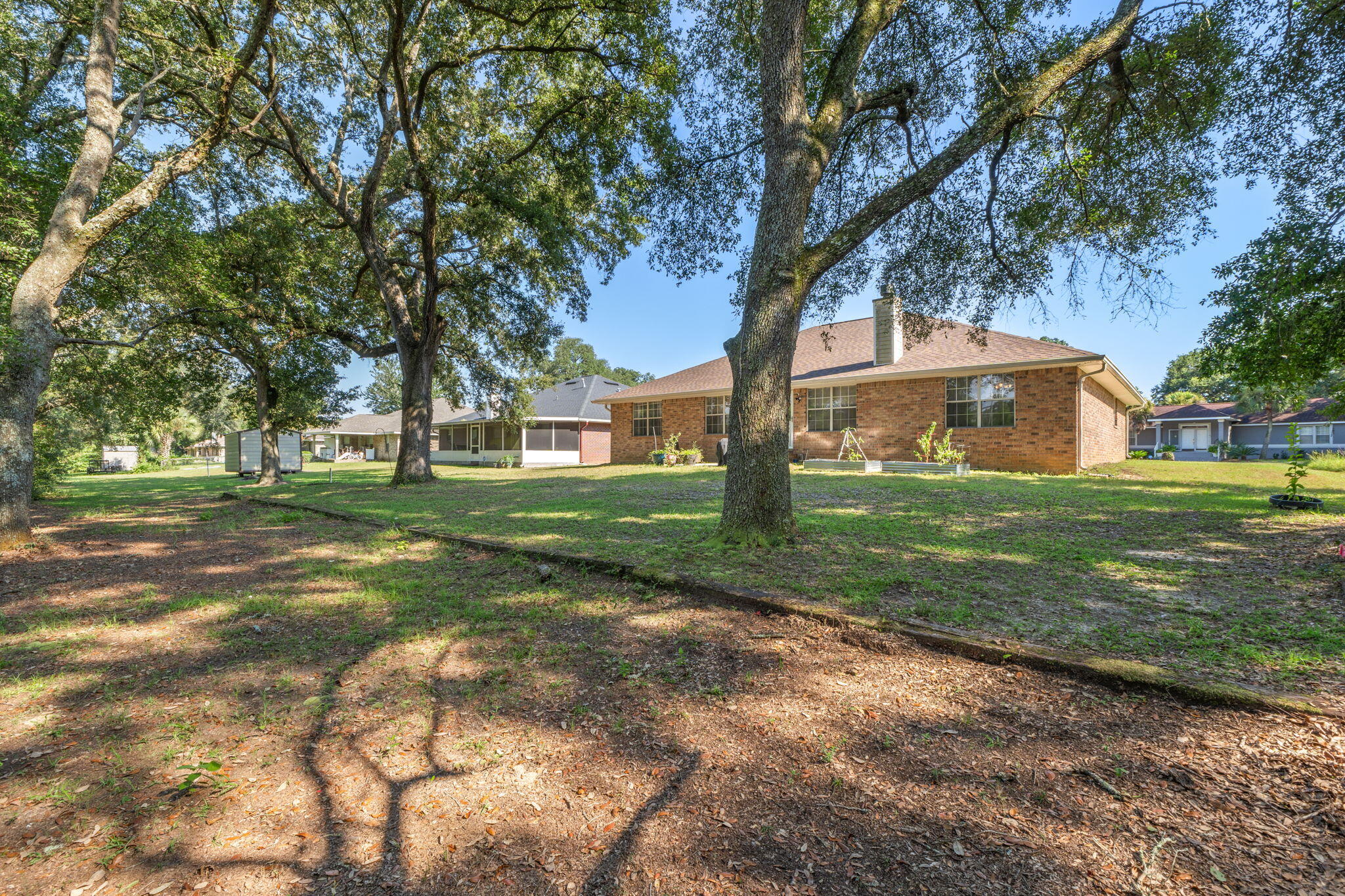 7036 Rampart Way Pensacola, FL 32505 - Photo 32 of 39 a view of a house with a yard