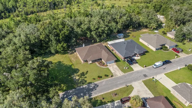 an aerial view of a house with a garden