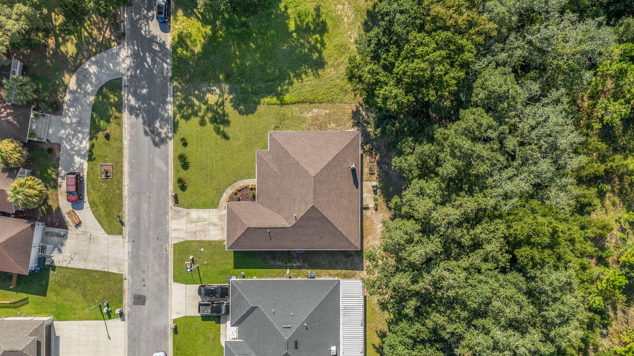 7036 Rampart Way Pensacola, FL 32505 - Photo 34 of 39 an aerial view of a house with swimming pool and garden space