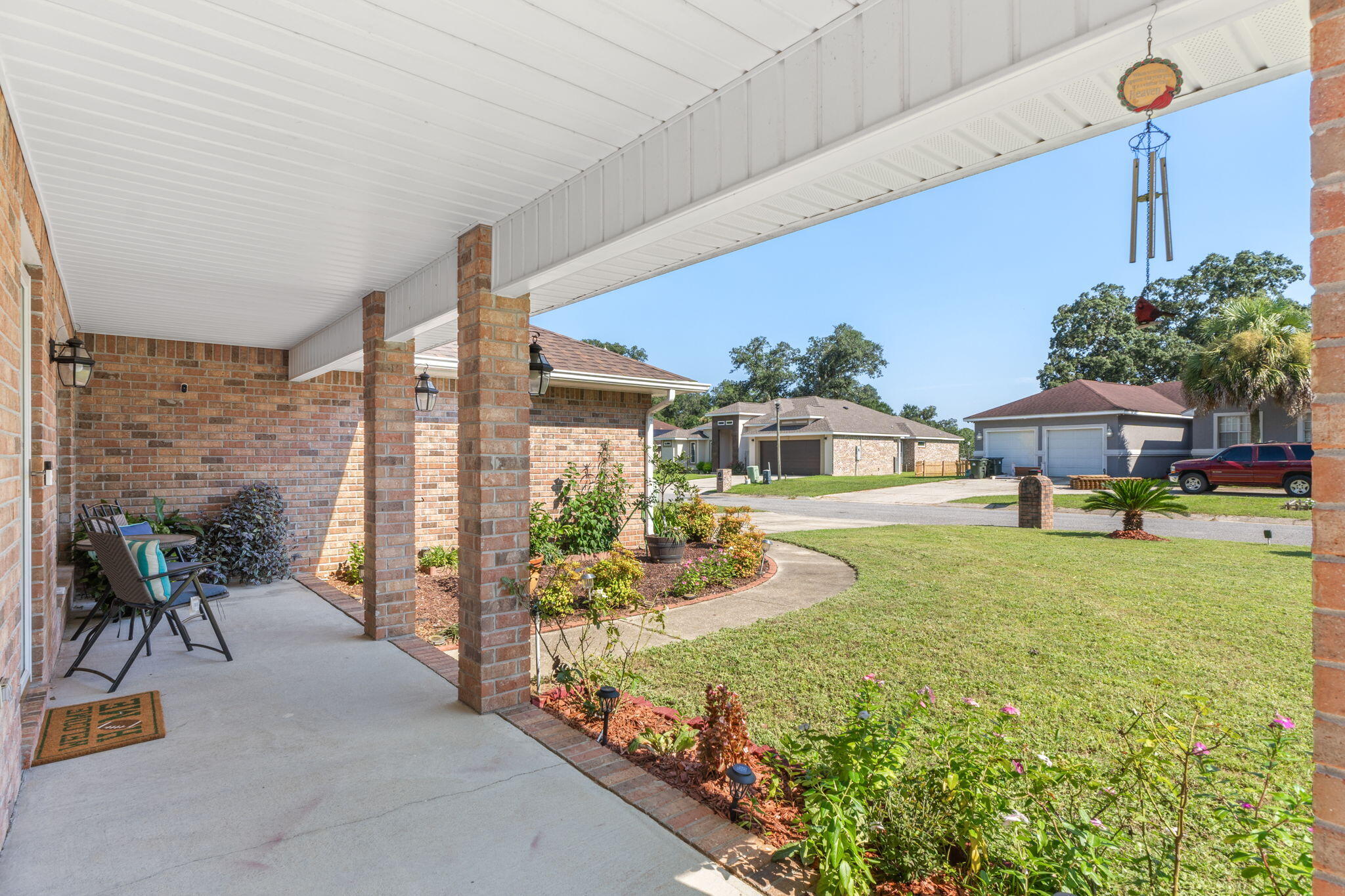 7036 Rampart Way Pensacola, FL 32505 - Photo 4 of 39 a front view of a house with garden