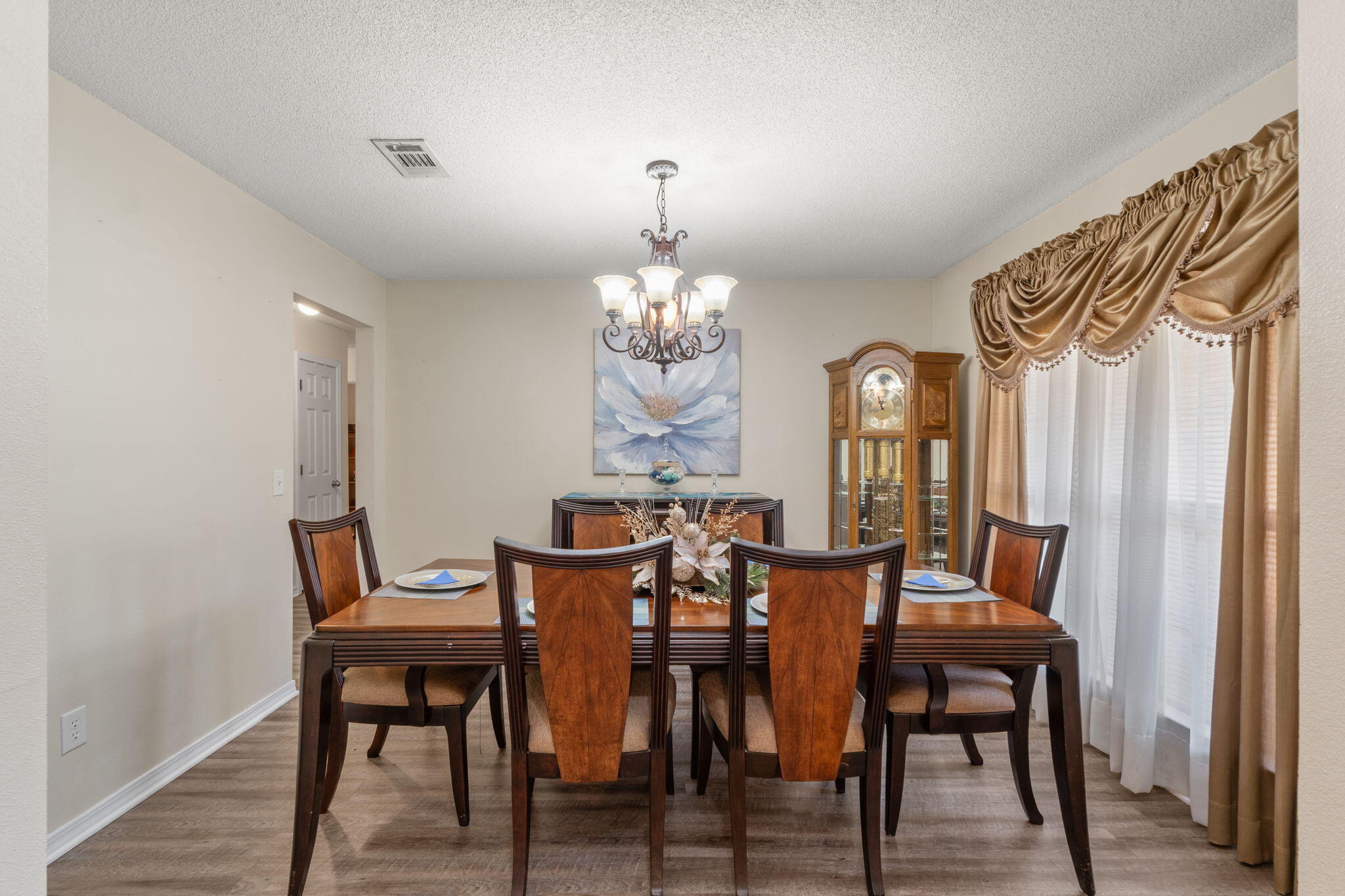 7036 Rampart Way Pensacola, FL 32505 - Photo 7 of 39 a view of a dining room with furniture and chandelier